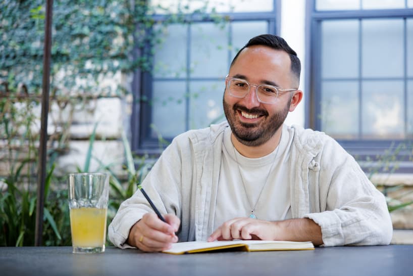 Dr. Cameron Martin writing